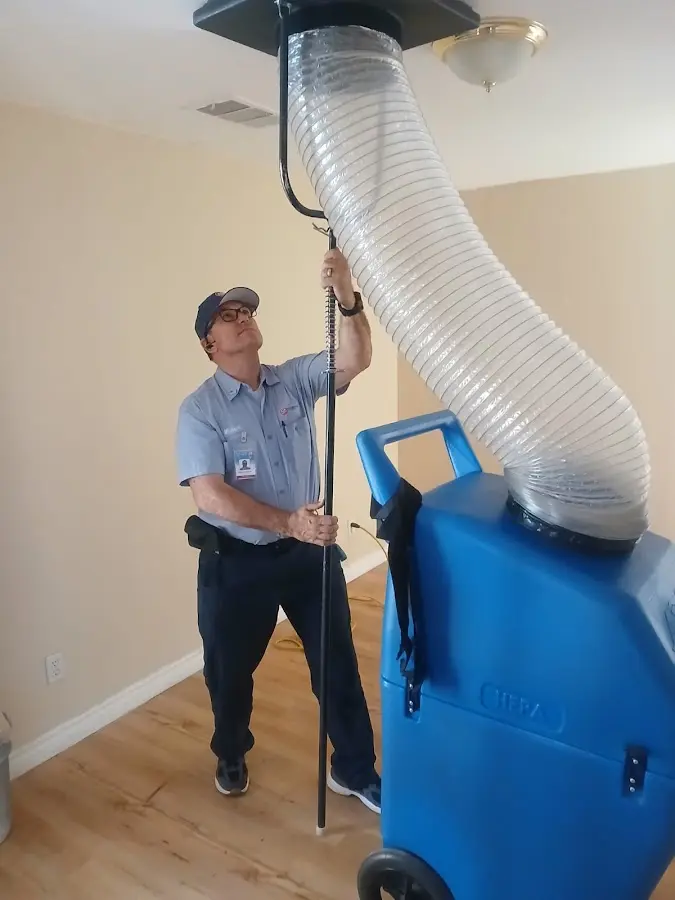 Furnace Tune-Up technician using HEPA equipment in Hoffman Estates